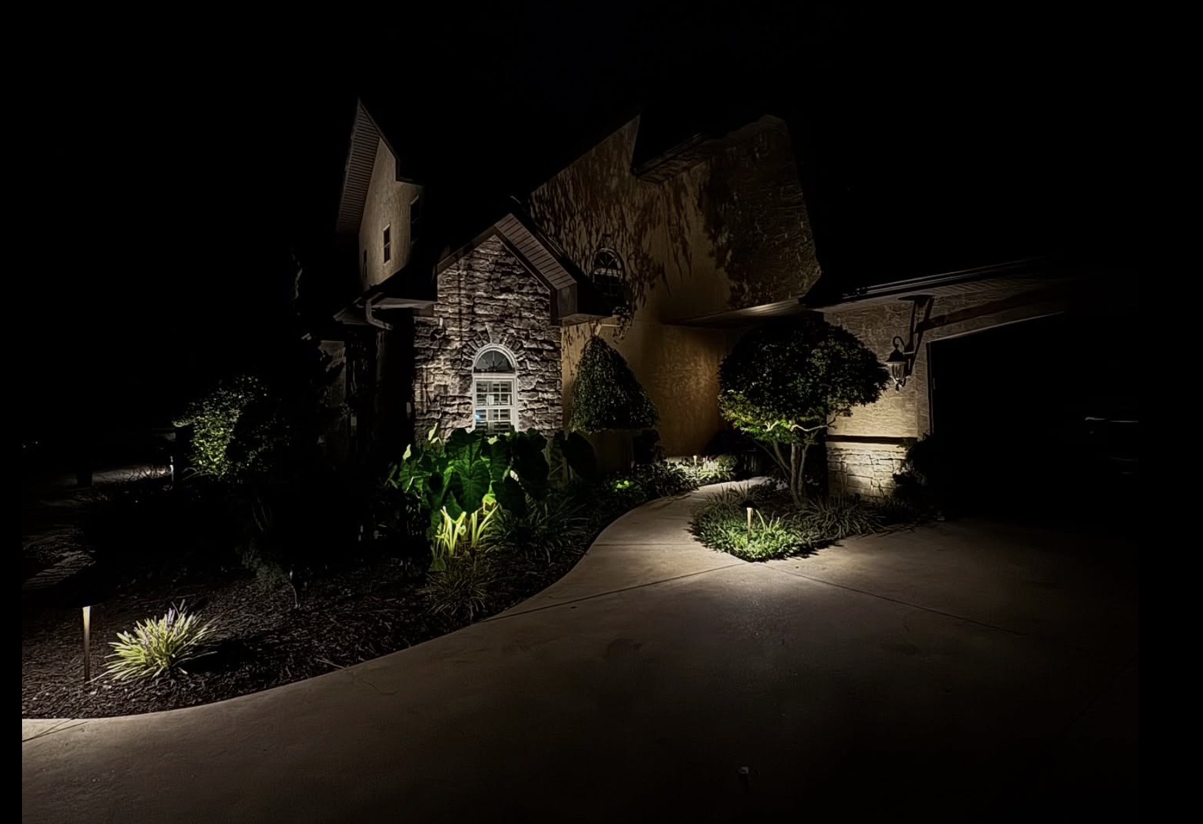Stone Home Pathway Lighting Luxury stone home with dramatic pathway lighting